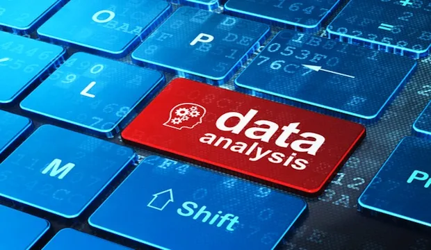 Red keyboard key labelled data analysis with a head-and-gears icon, among blue keys
